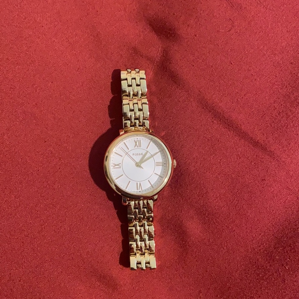 Small gold fossil watch
